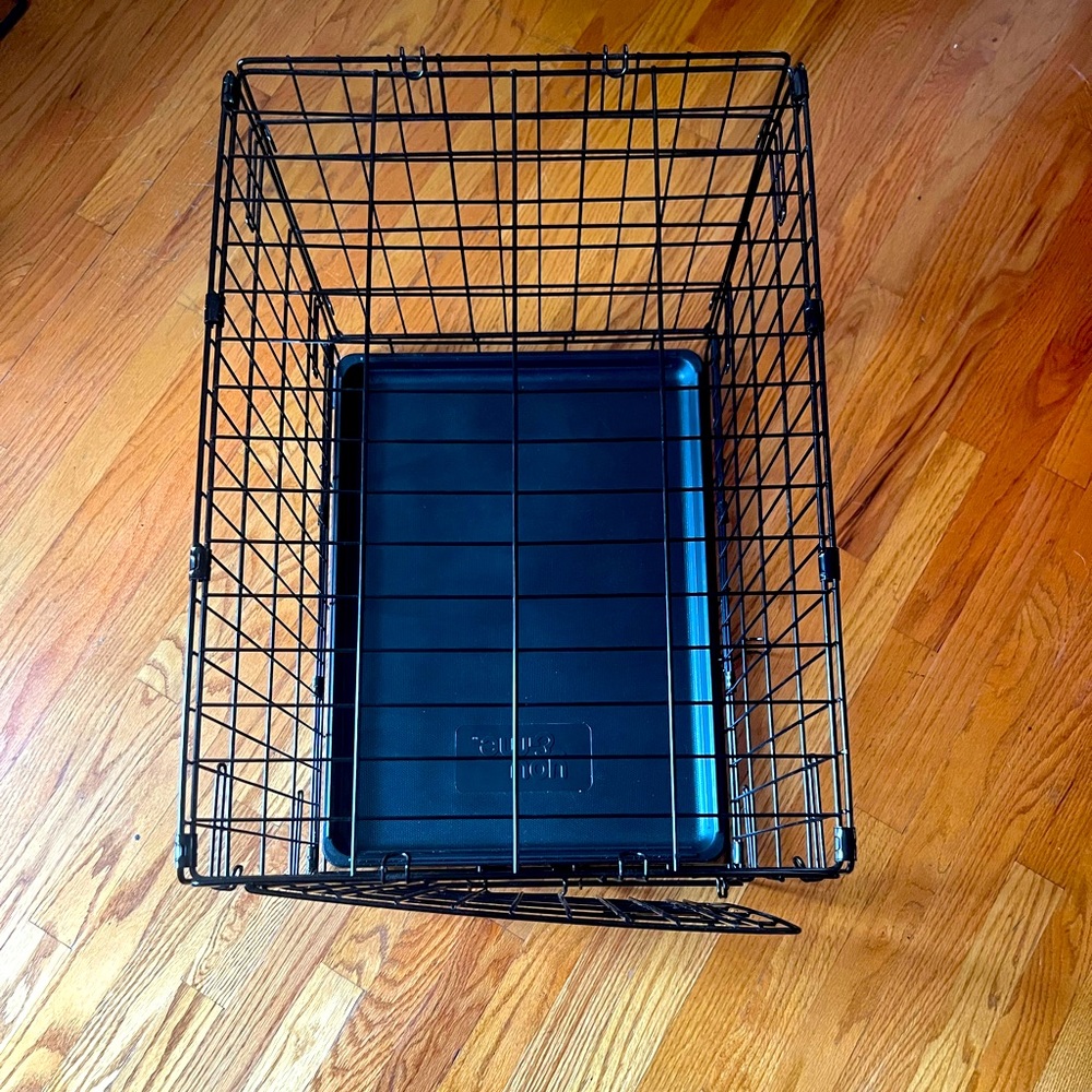 Small, collapsible, dog crate with removable tray
